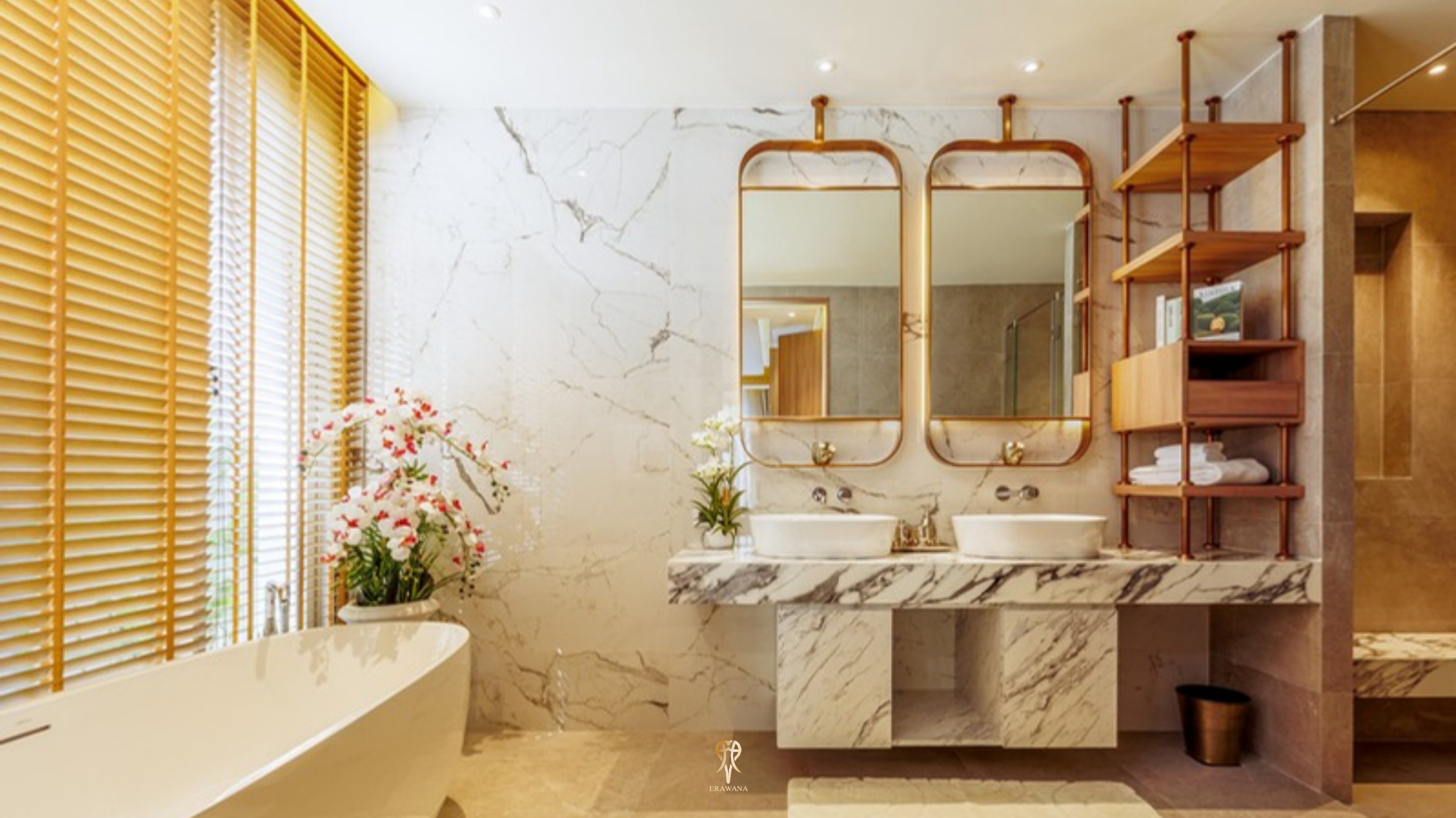Marble ensuite bathroom with twin vanities and freestanding bath